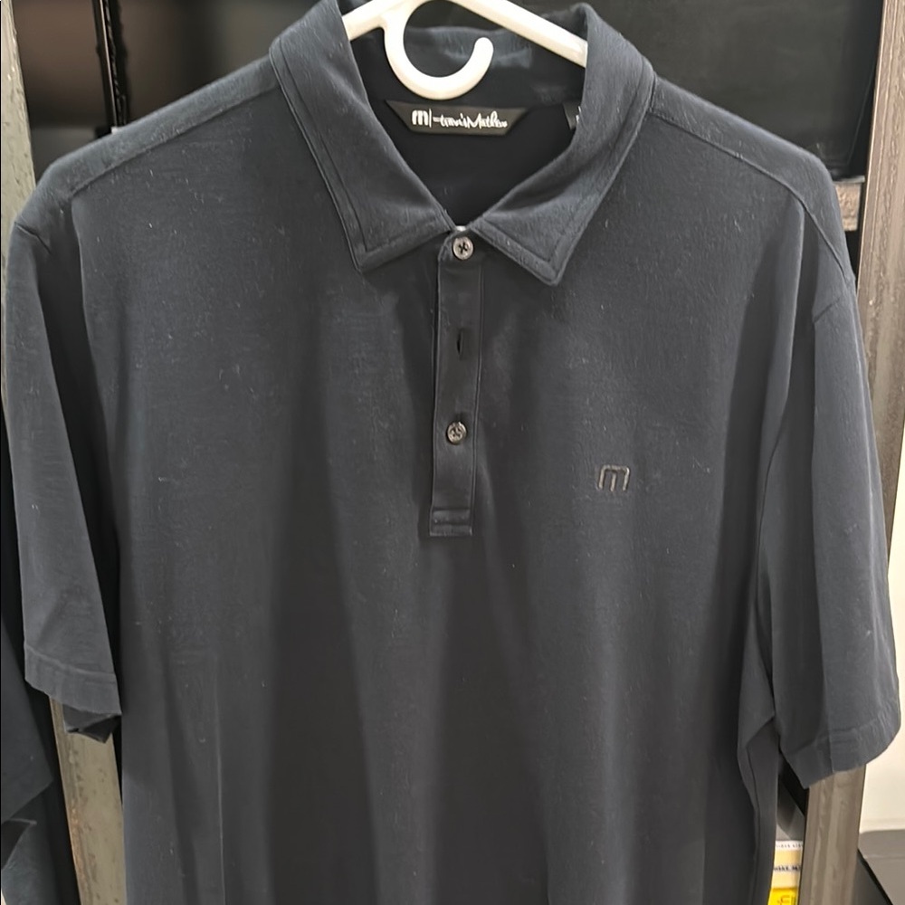 Travis Mathew Black Golf Polo Shirt with Subtle Logo